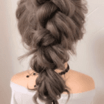 483011128786870330 A messy tall ponytail hairstyle